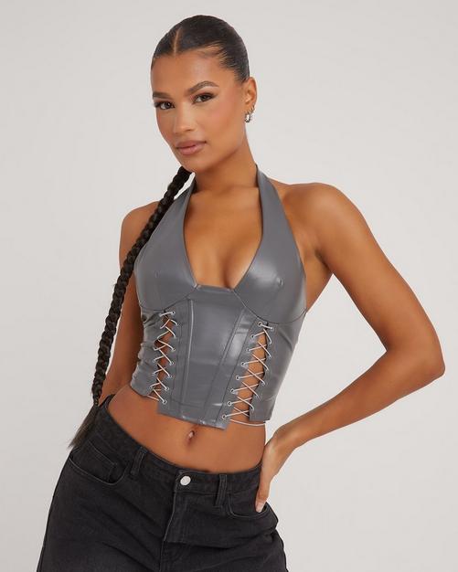BUCKLED UP FAUX LEATHER SPIKED CORSET TOP in black