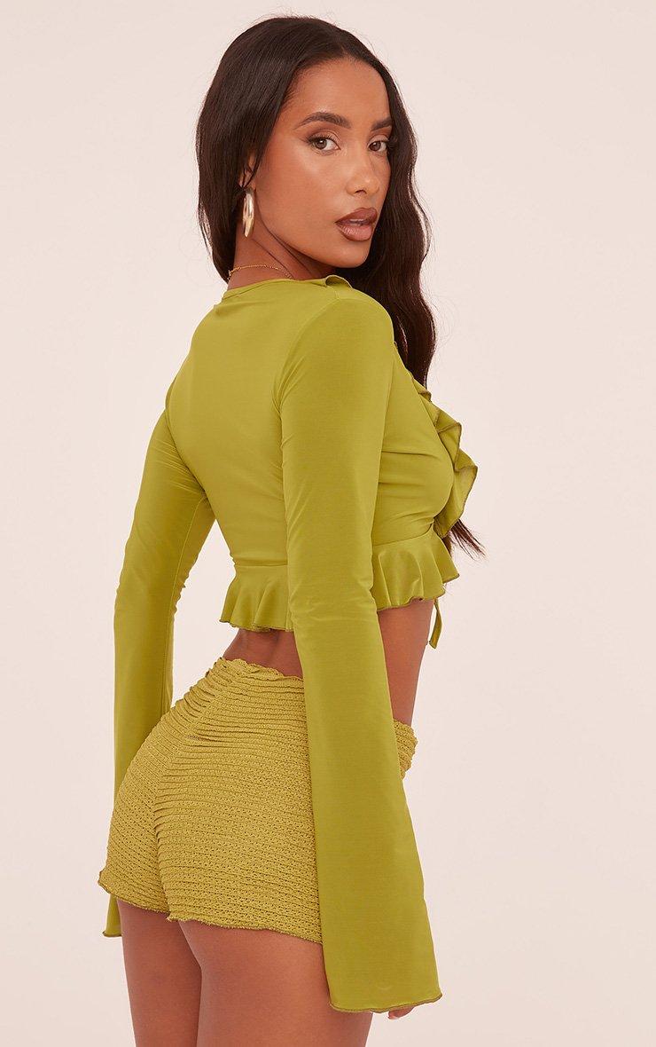 Long Sleeve Frill Detail Tie Front Crop Top In Green Slinky | EGO