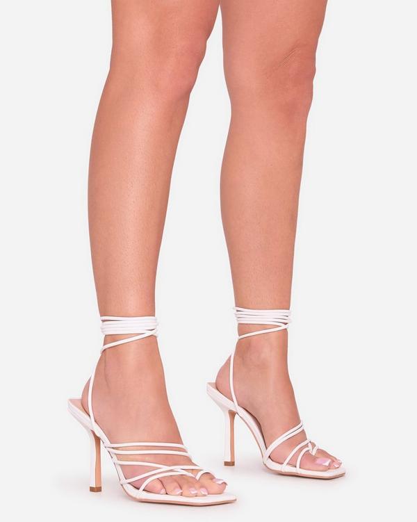 Tour-Tot Lace Up Strappy Heel In White Faux Leather