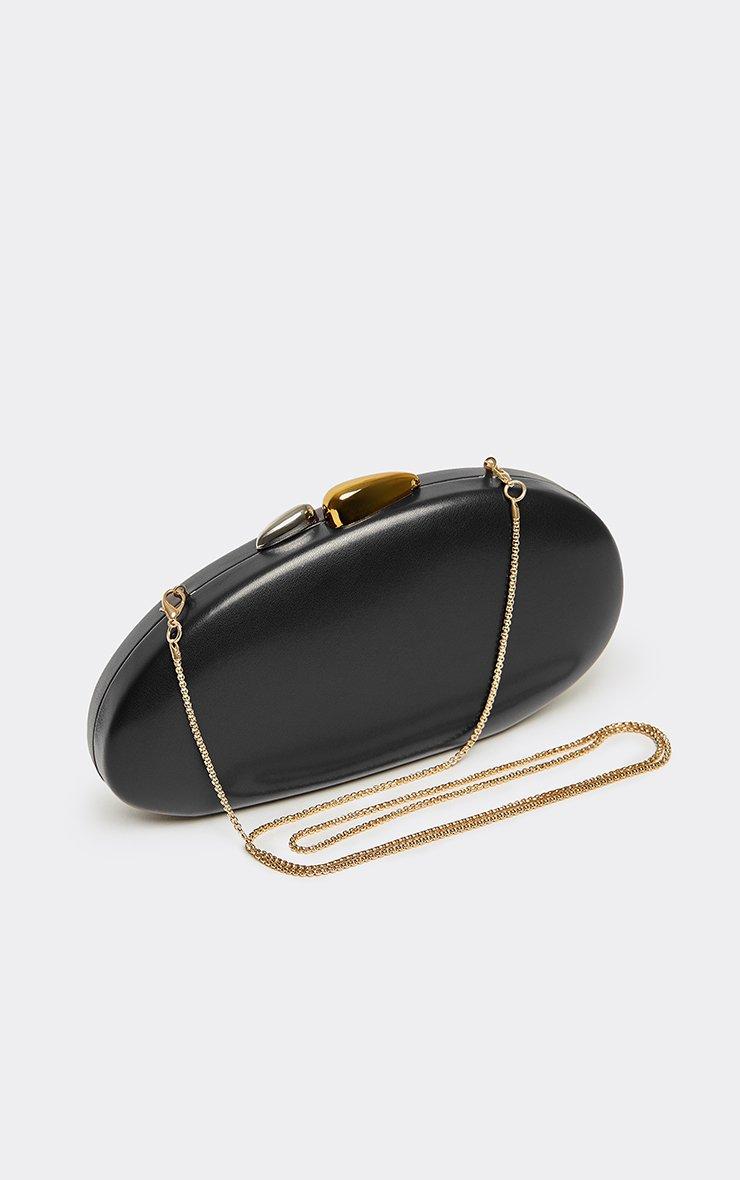 Wyatt Gold And Silver Clasp Shaped Clutch Bag In Black Faux Leather.