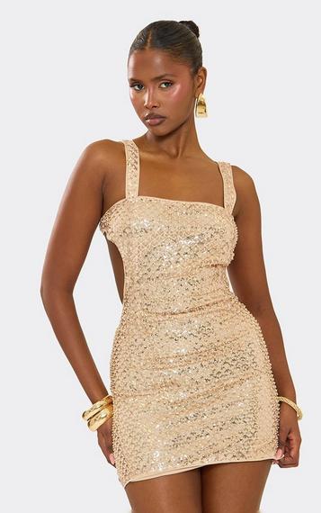 gold.mini dress Marbella Sequin Embellished Scoop Neck Ruffle Hem Mini Gold A shiny gold sequin pattern adorns a sheer mesh overlay (atop a beige knit lining) that shapes a romantic sweetheart neckline and a bustier Axel Sequin Mini Dress Gold
