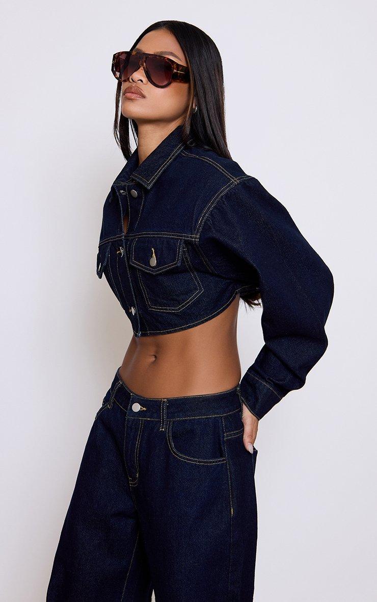 cropped jacket over fitted indigo knee length dress 7 Ways to Wear Your Denim in the Warmer MonthsProof It's the Most Timeless Wardrobe Staple Finished with an authentic woven label One of the most common