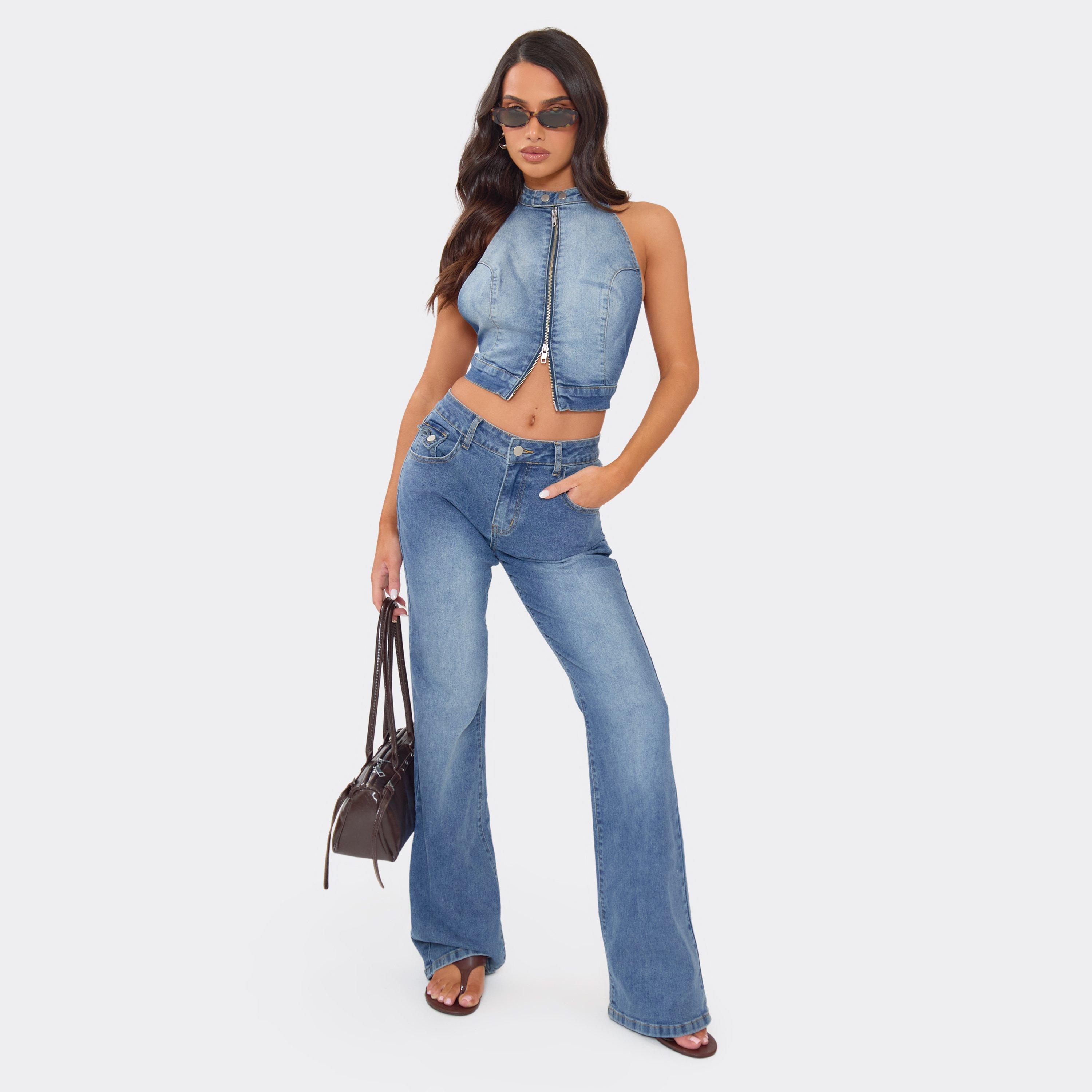 Image of Extreme Low Rise Flared Leg Jeans In Blue Wash Denim, Women's