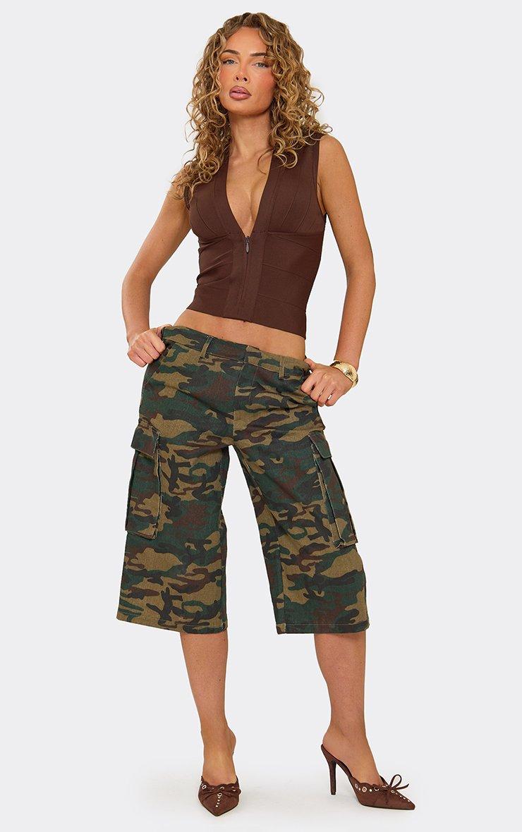 Low Rise Cargo Jorts In Green Camo Print Denim.
