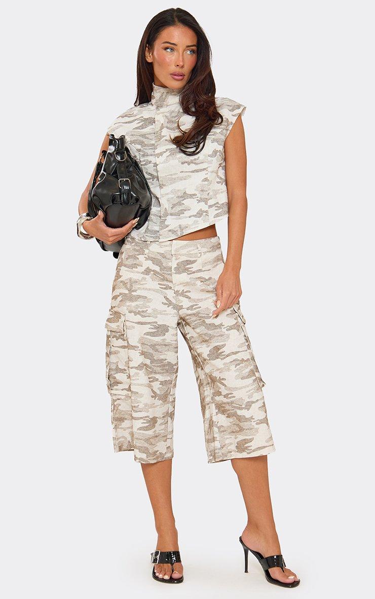 Sleeveless Funnel Neck Asymmetric Hem Fitted Top In Green Camo Print Denim.