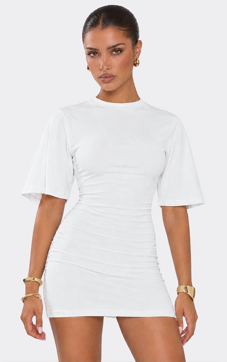 Cap Sleeve Mini Dress In White Jersey.