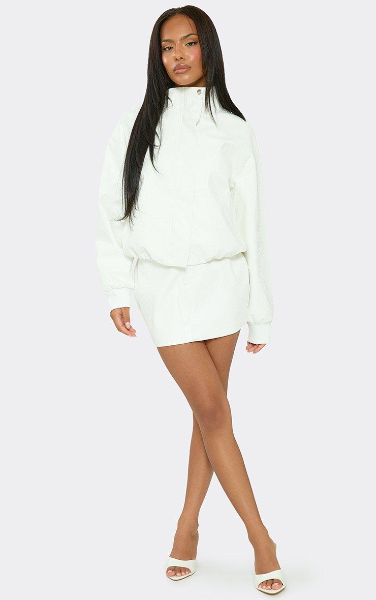 Mid Rise Mini Skirt In White Woven Faux Leather