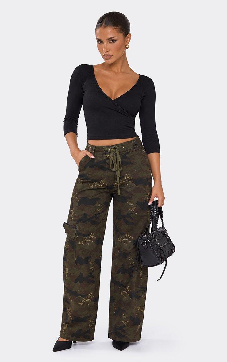 Three Quarter Sleeve Plunge Wrap Front Top In Black Ribbed Cotton