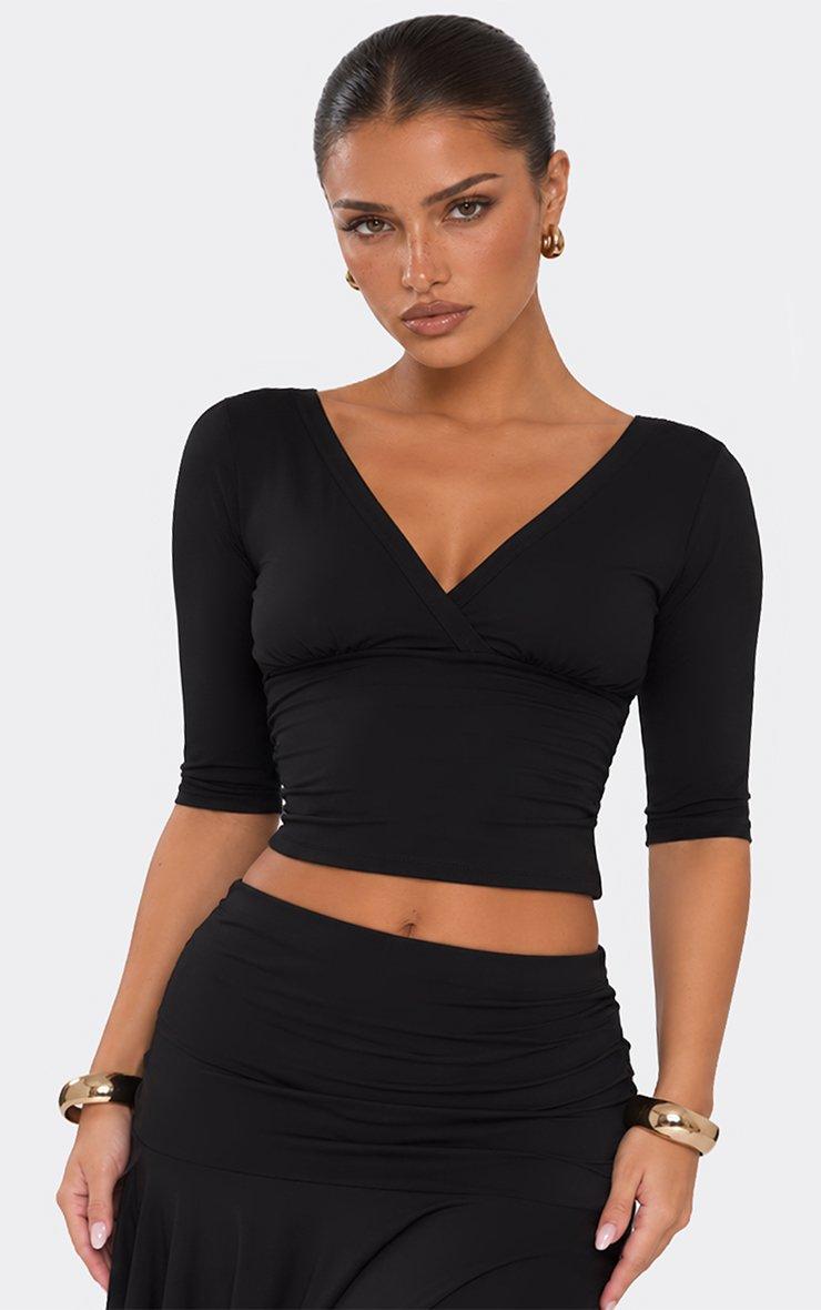 Three Quarter Sleeve Wrap Front Top In Black.