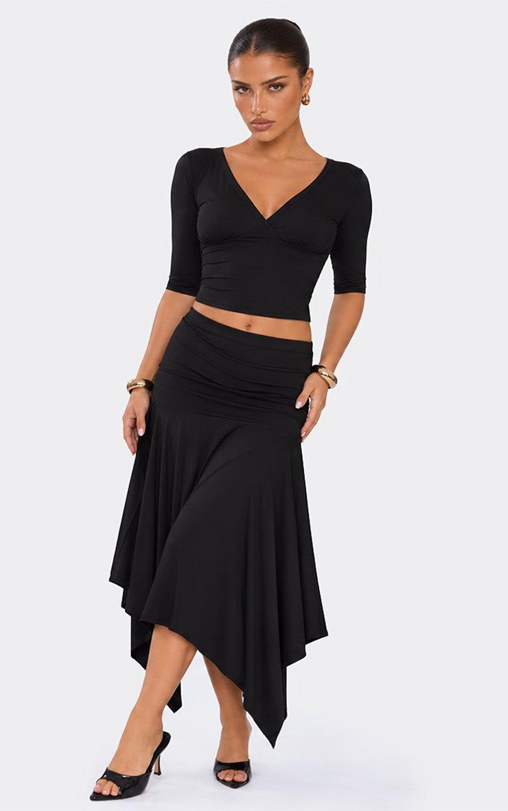 Three Quarter Sleeve Wrap Front Top In Black.
