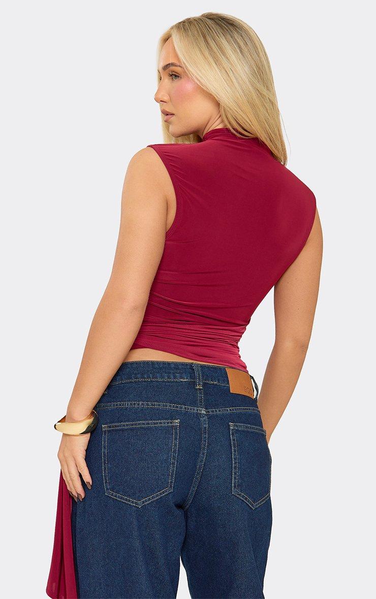 Sleeveless High Neck Tie Drape Front Top In Burgundy Slinky