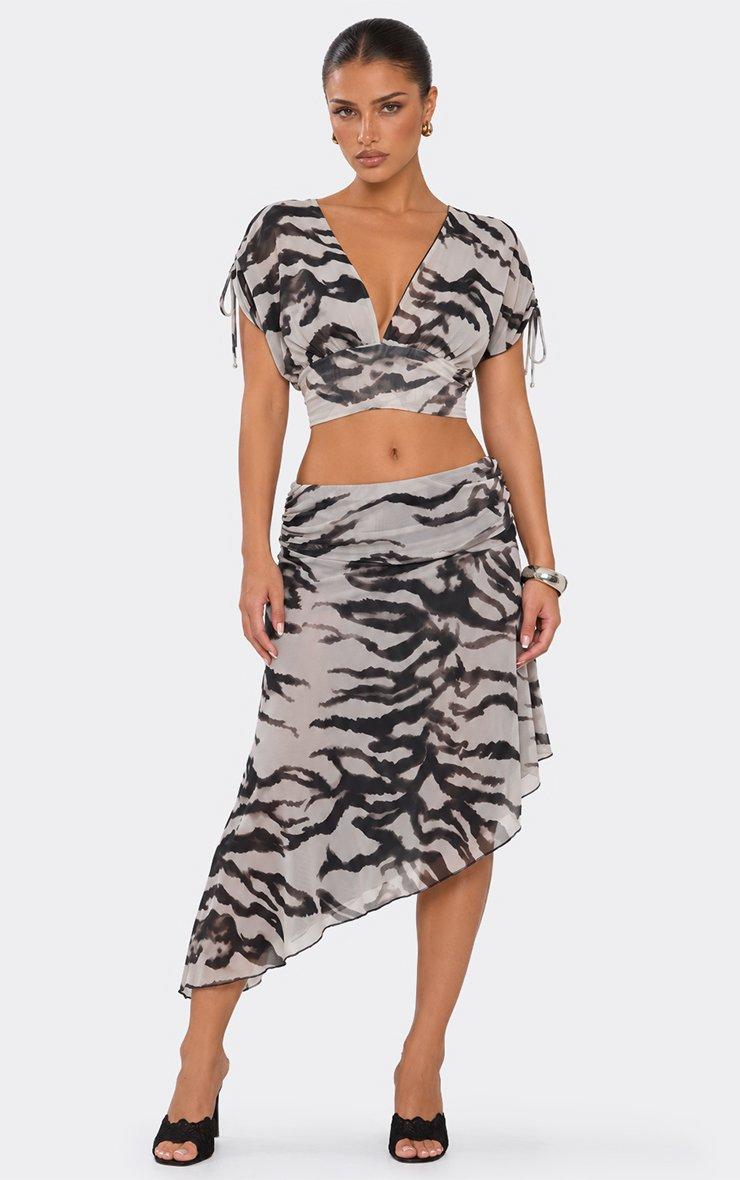 Mid Rise Asymmetric Hem Midi Skirt In Black Animal Print