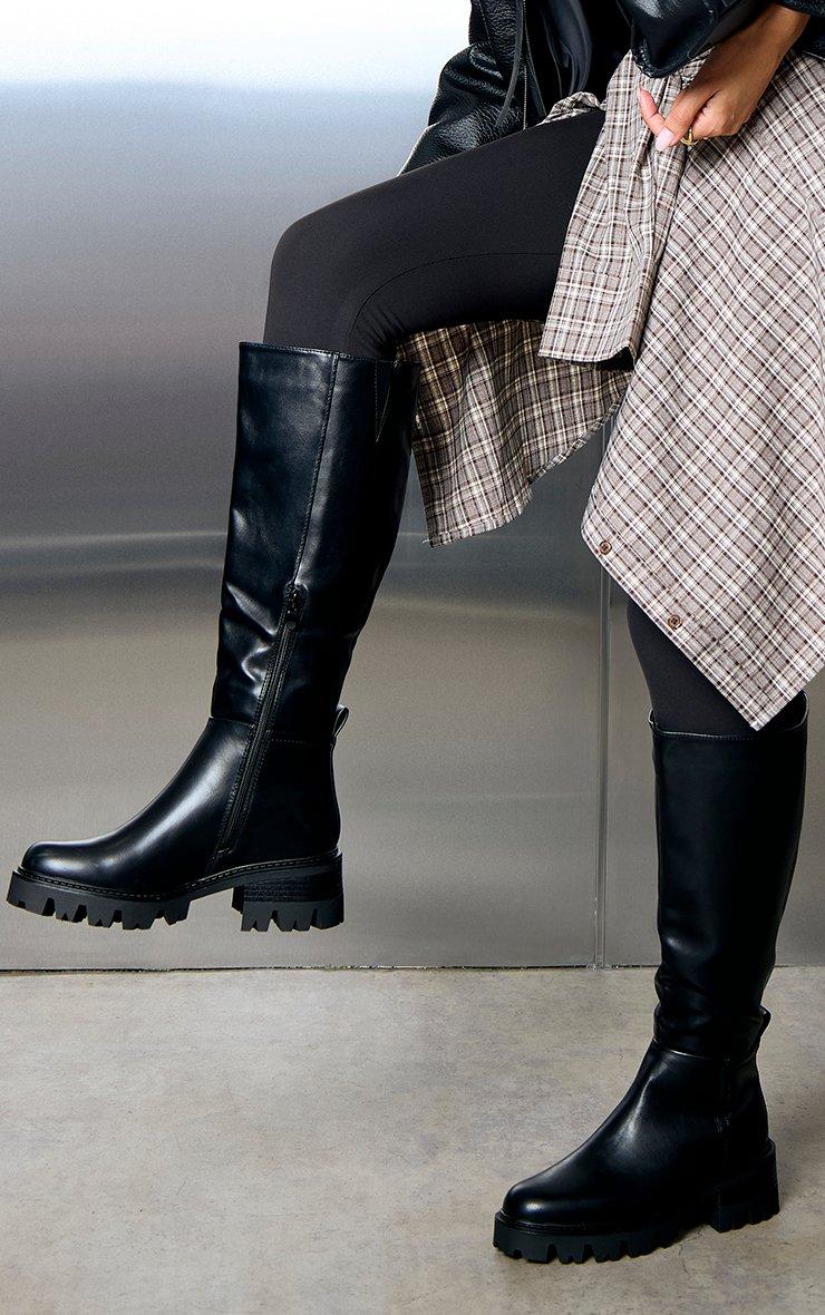 Della Chunky Sole Knee High Long Biker Boot In Black Faux Leather.