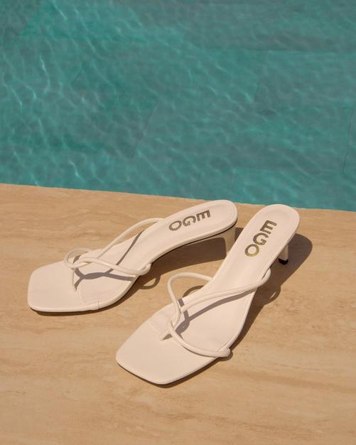 High-Tides Twisted Strap Heel Mule In White Faux Leather