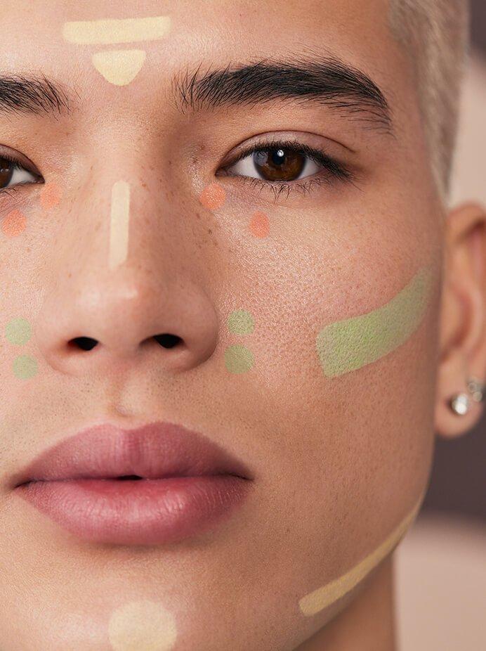 Male model wearing the camo color correctors on his face