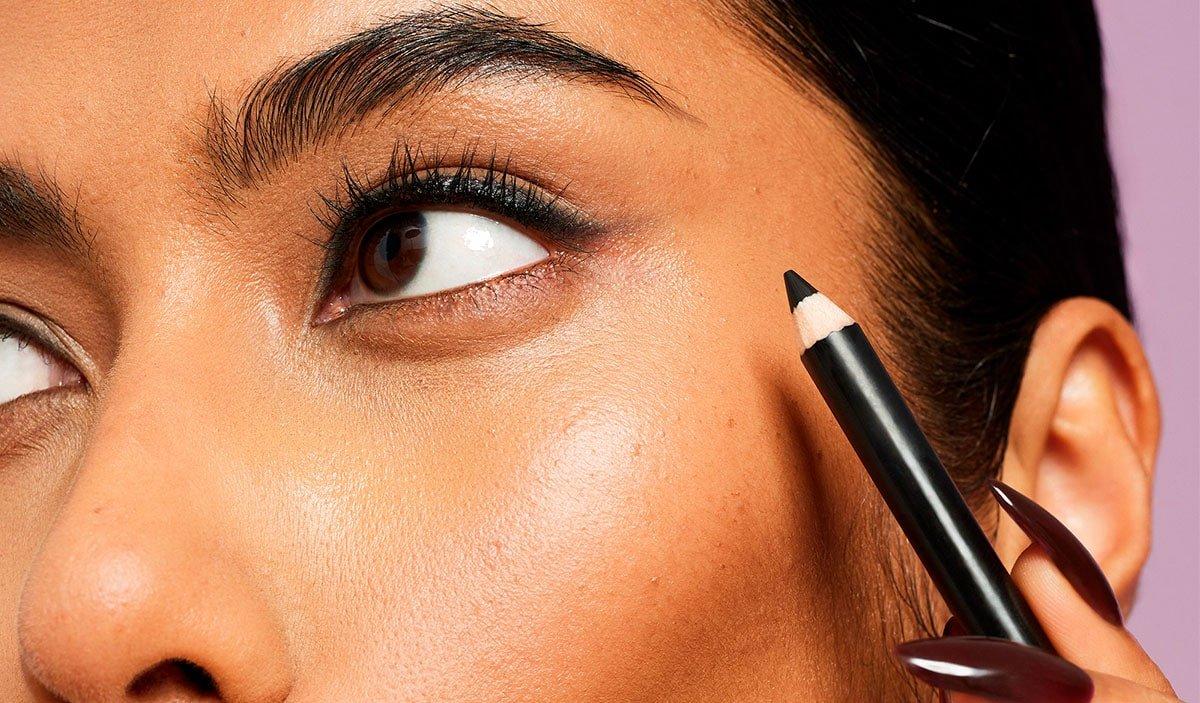 Model Applying Eyeliner