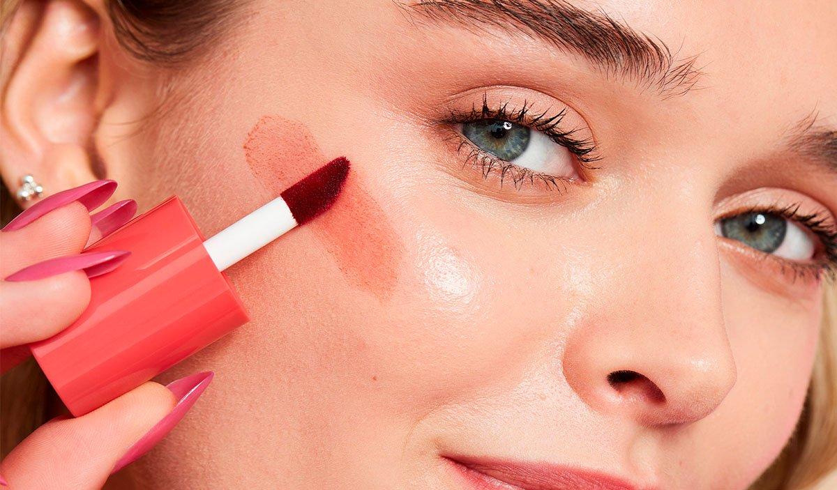 Model Applying Blush Tint to Cheek 