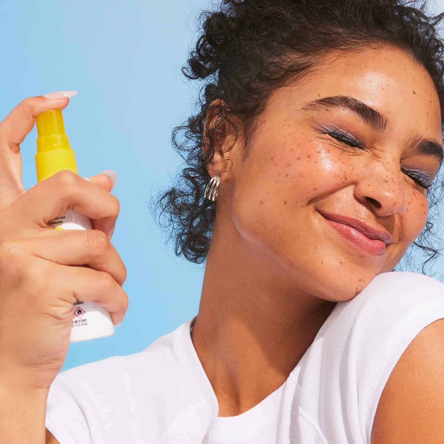 Model using e.l.f. SKIN All Set for Sun spray