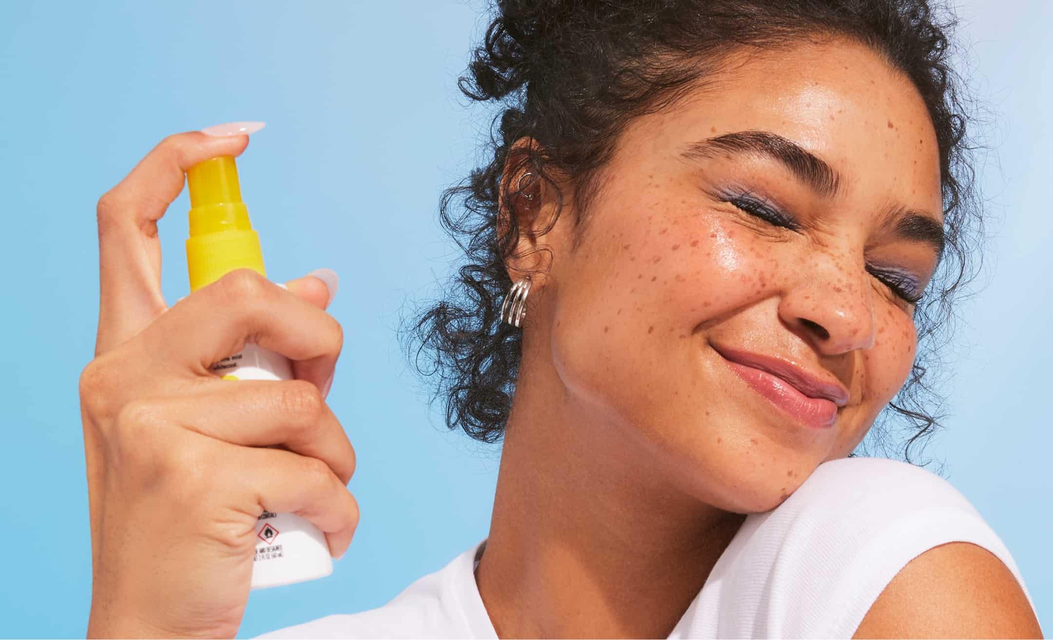 Model using e.l.f. SKIN Suntouchable All Set for Sun spray