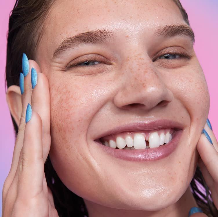 A model looking happy using Thirst Burst Drops