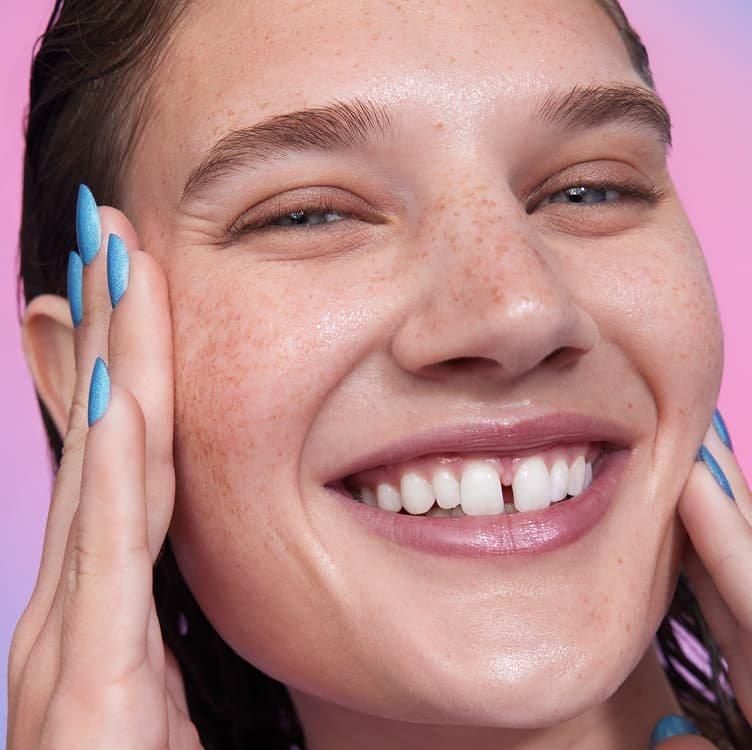 A model looking happy using Thirst Burst Drops