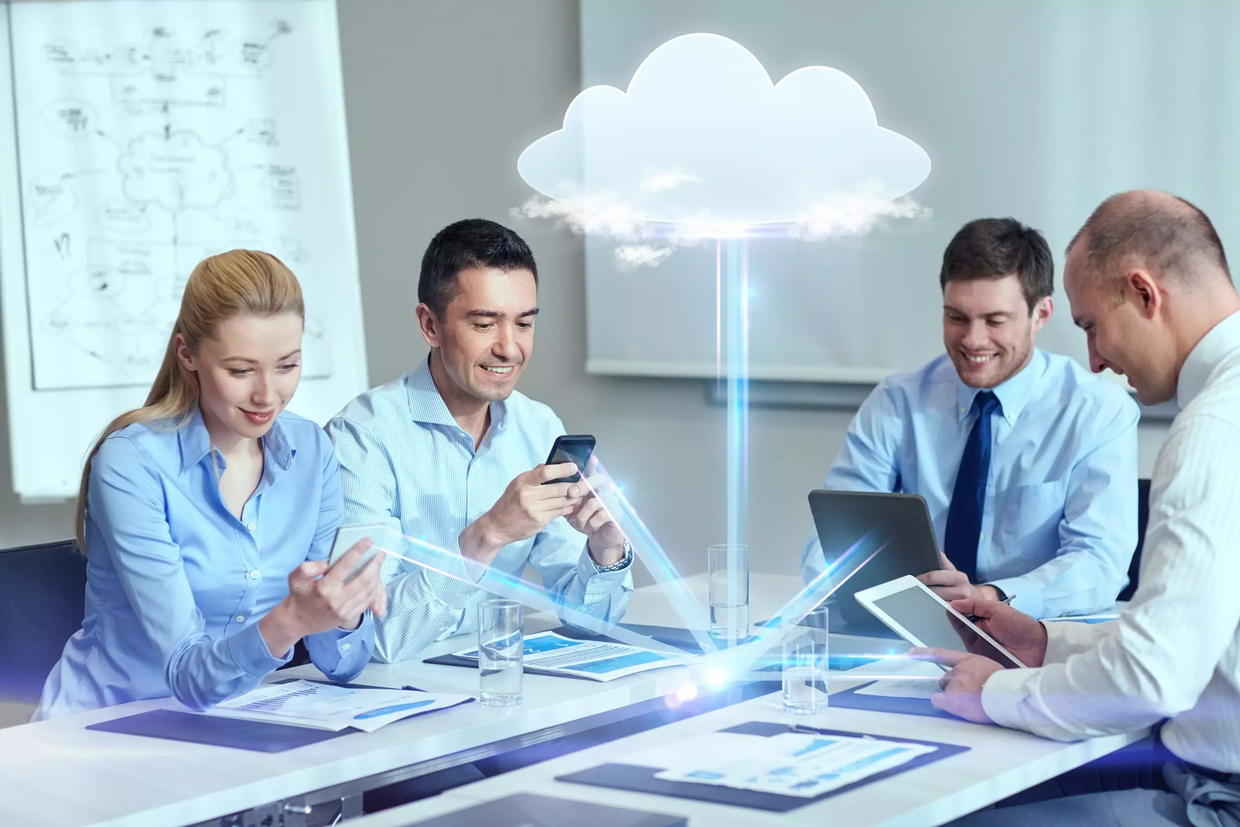 business people cloud computing technology concept smiling business team with smartphones tablet pc computers working office