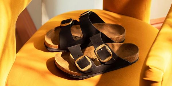 Black open toe buckle sandals by Birkenstock