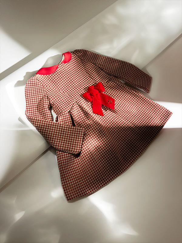 Little red dress with a bow on it