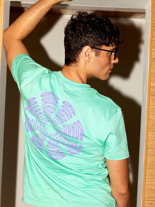 Man in bright turquoise patterned t shirt