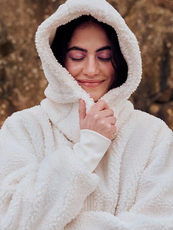 woman wearing cream jacket