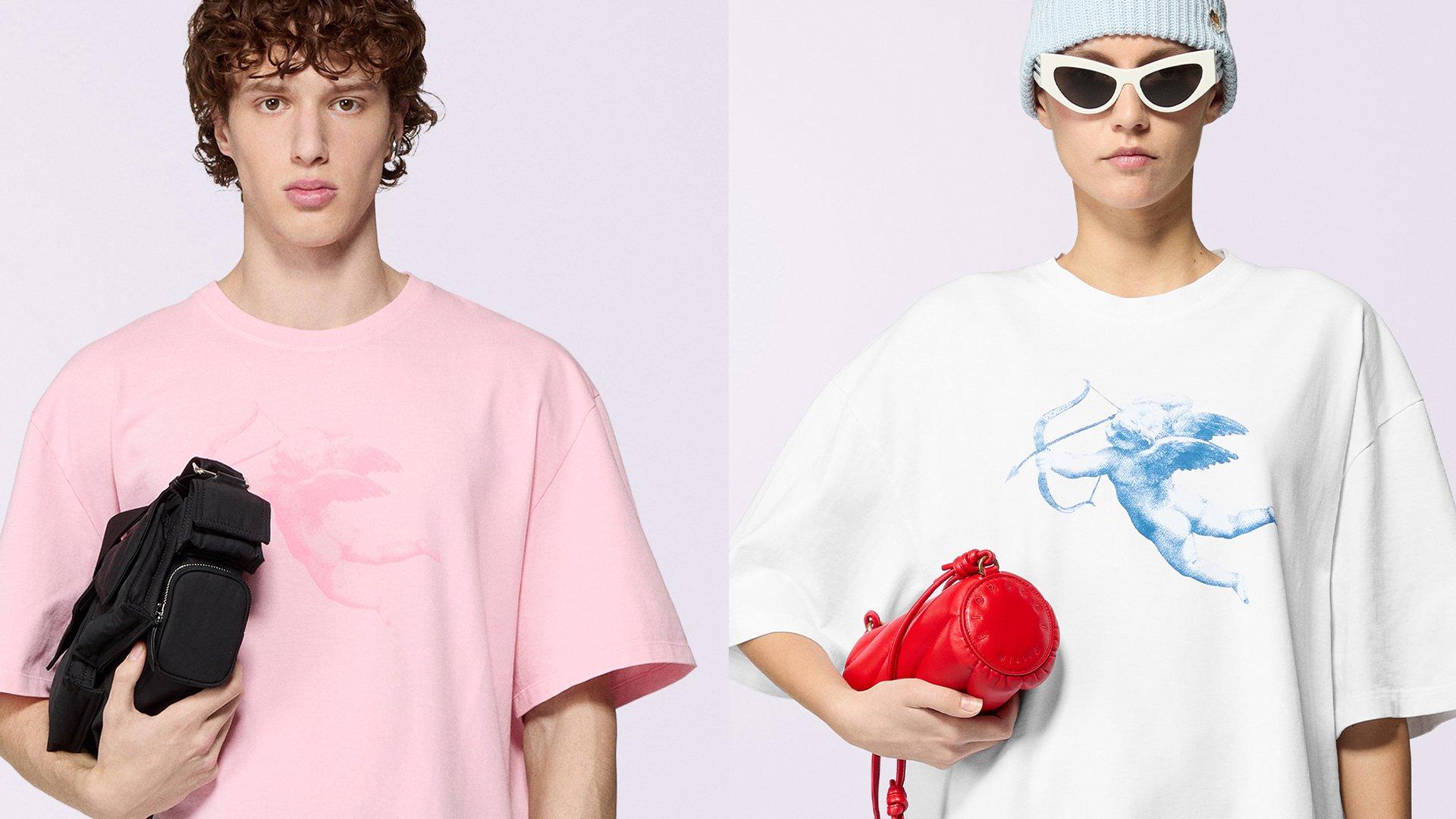 Male model wears the Unisex Cupid Graphic T-Shirt in pink and female model wears the Unisex Cupid Graphic T-Shirt in white.