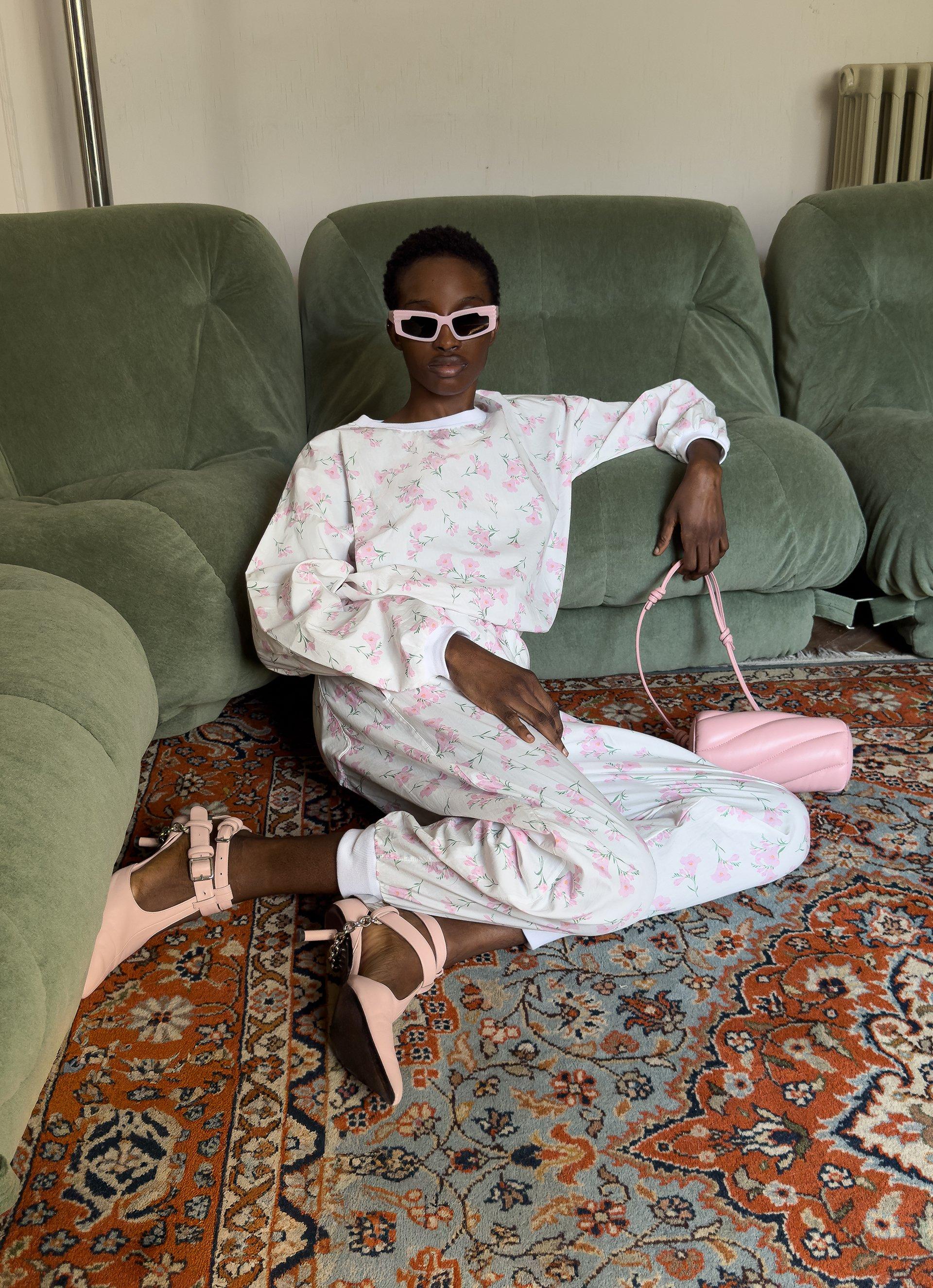 Model wears the Floral Sweatshirt in White and Floral Joggers in White.