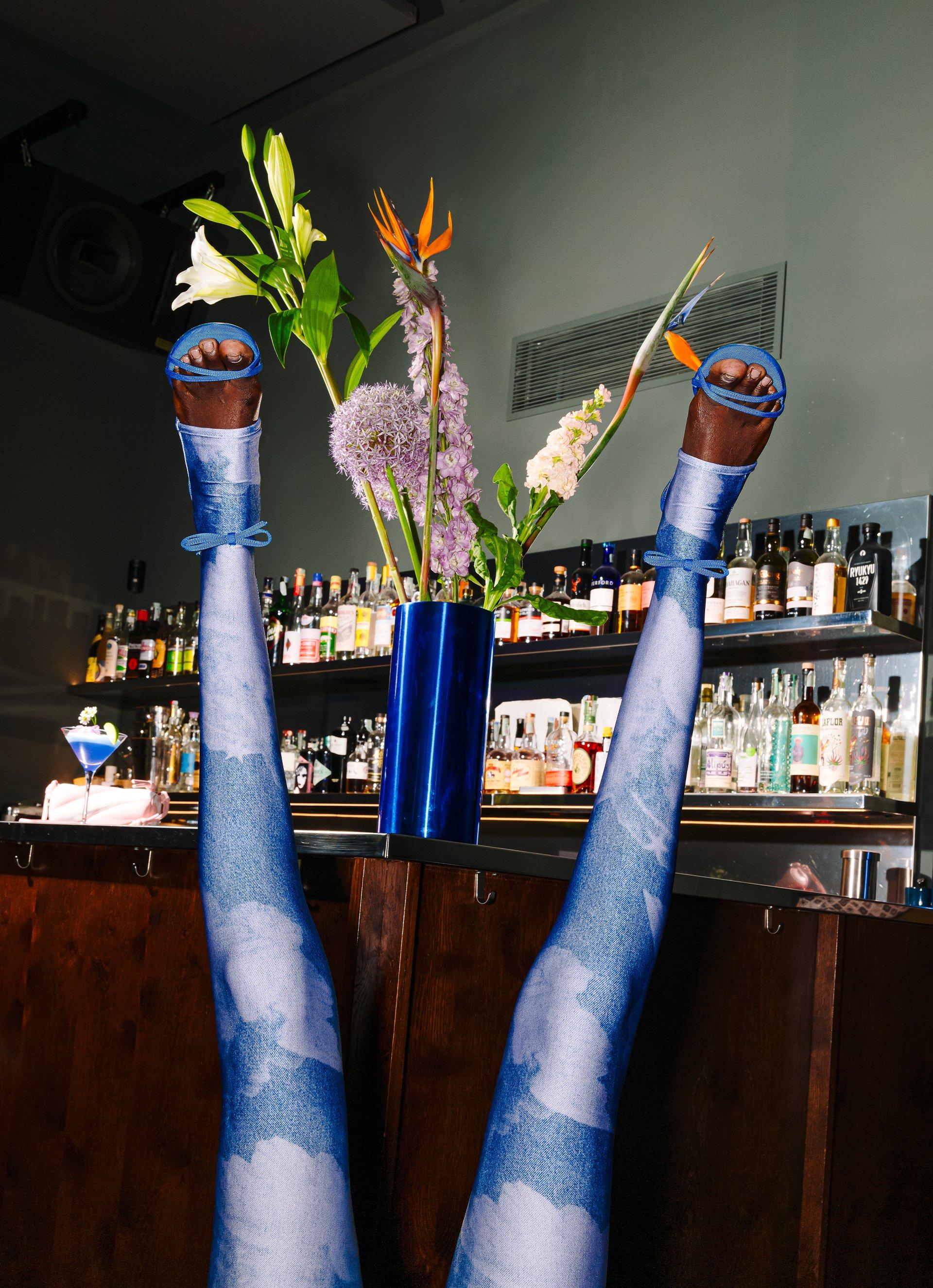 Model is wearing the Angels Semi-Footed Leggings in Blue.
