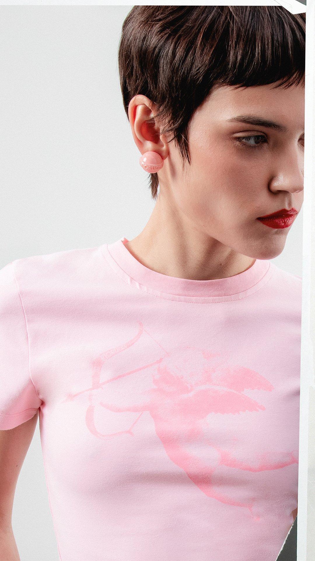 Model Cupid Graphic Baby T-Shirt in pink.