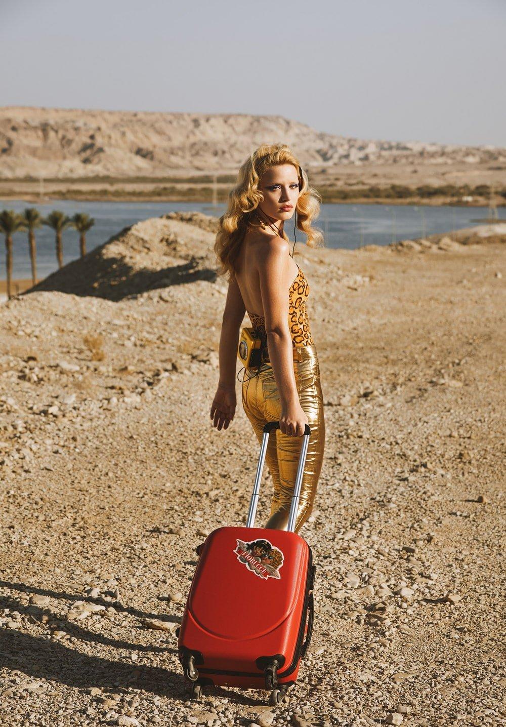 Georgia May Jagger wearing the Yves Vinyl Trousers in gold.