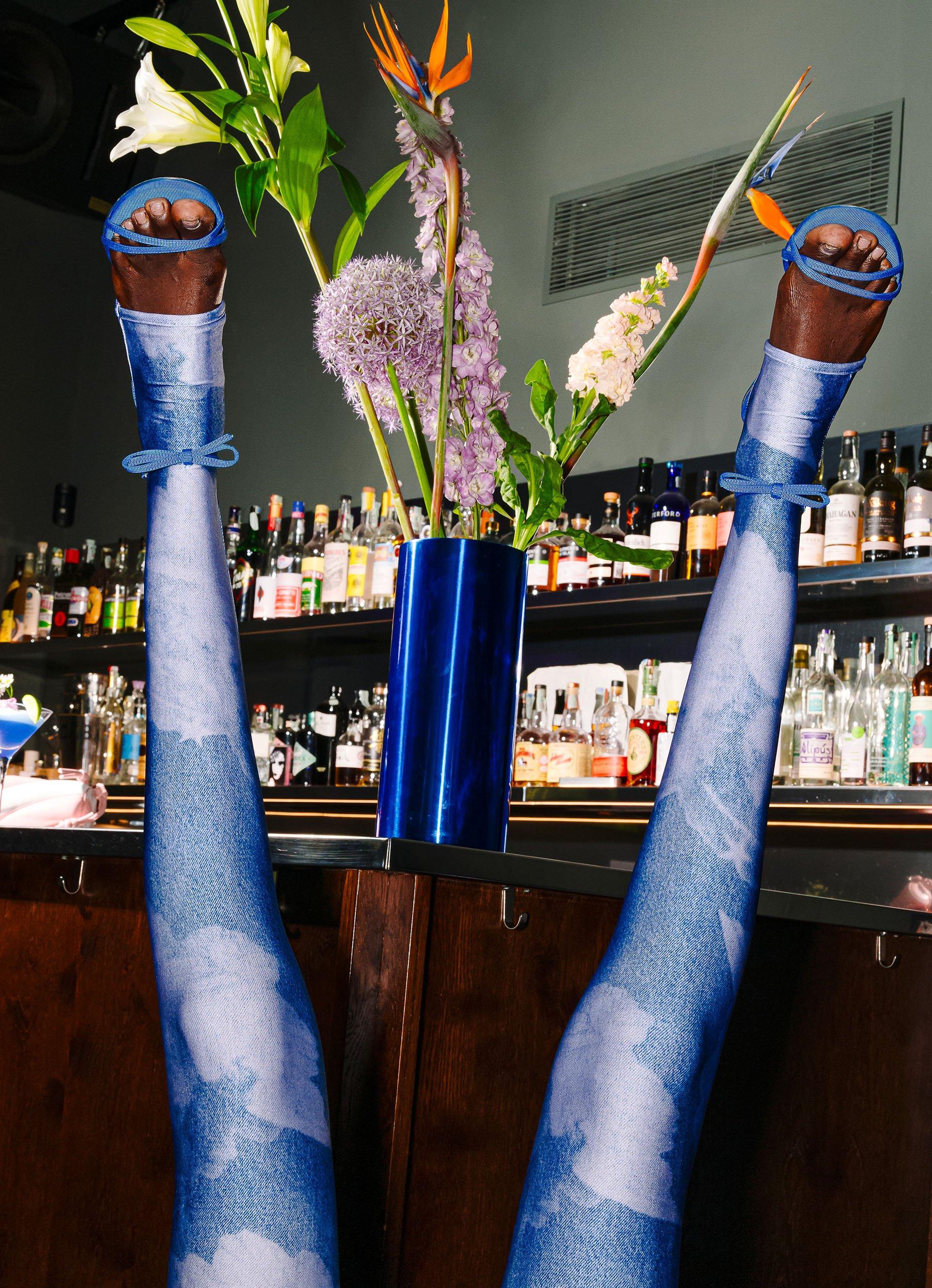 Model wears the Angels Semi-Footed Leggings in Blue.