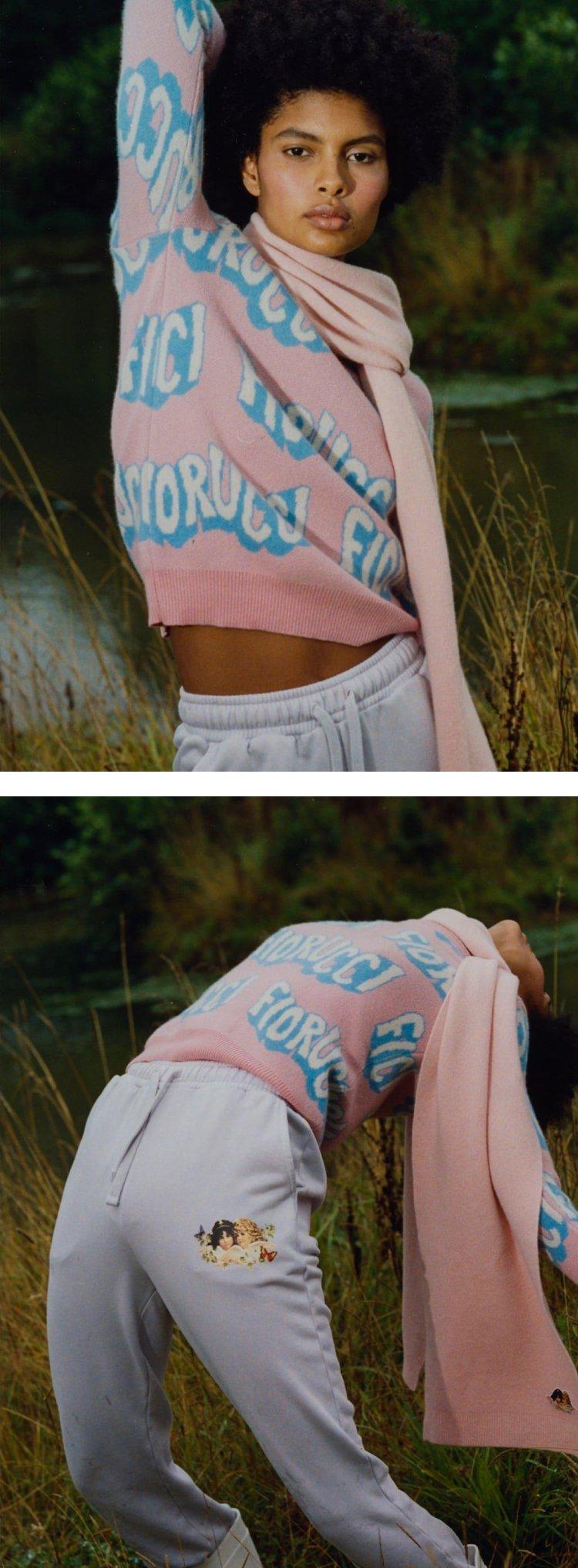 Model wearing the Woodland Wavy Logo Knit Jumper in Pink and Woodland Angels Patch Jogger in Pale Blue