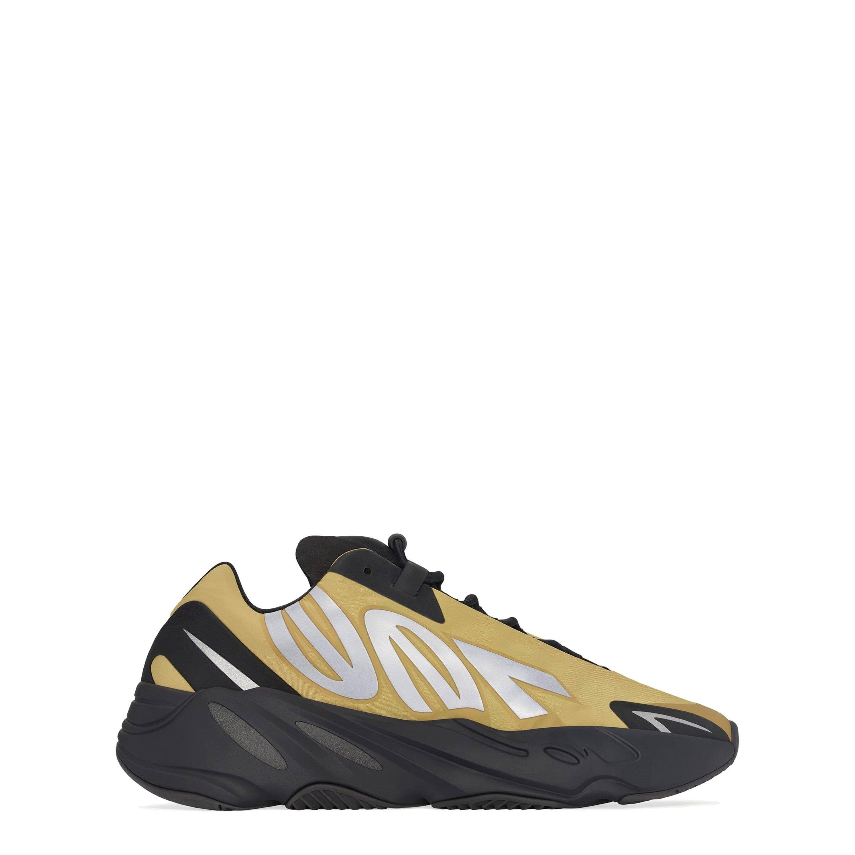 black and gold yeezy 700