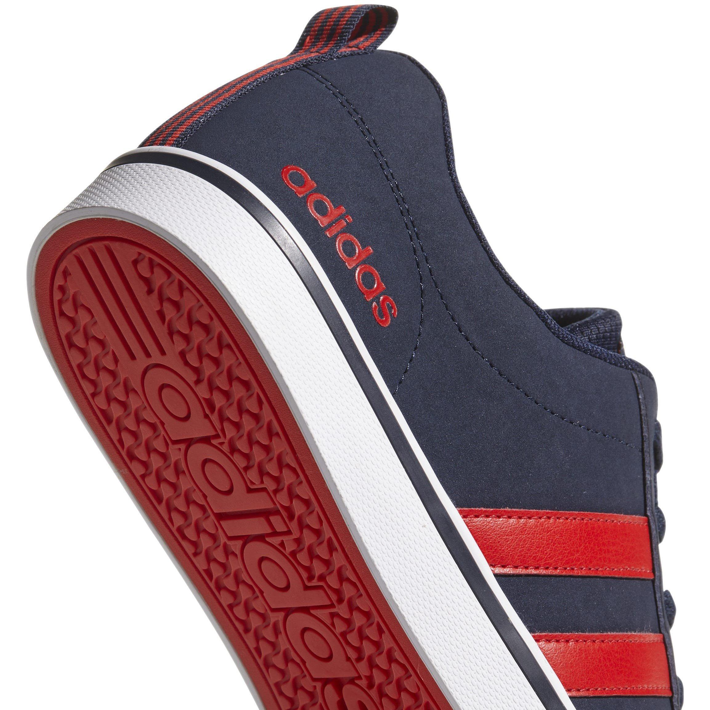 navy and red adidas trainers