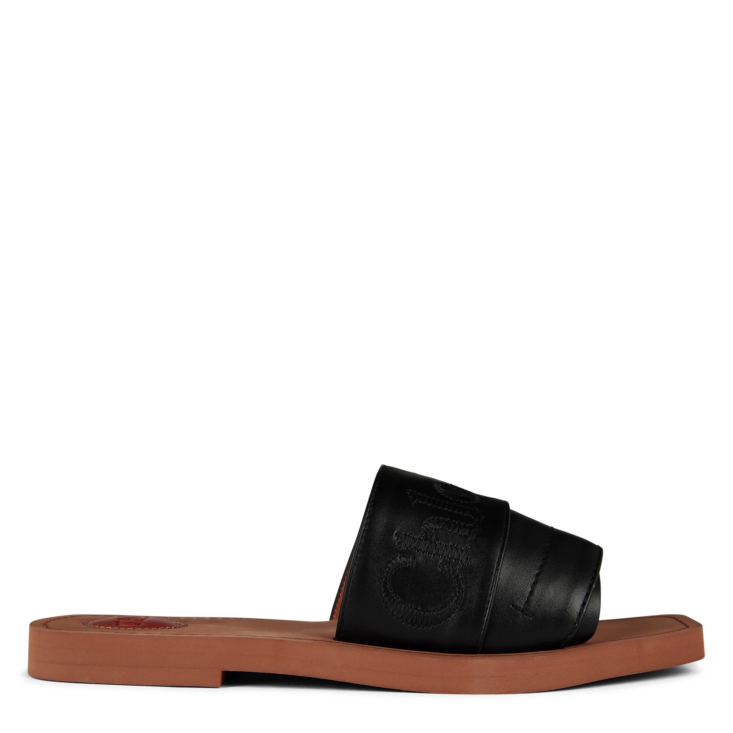 サンダル・ミュール CHLOE' Woody linen flat sandals BLACK Woody canvas slides in black - Chloe | Mytheresa
