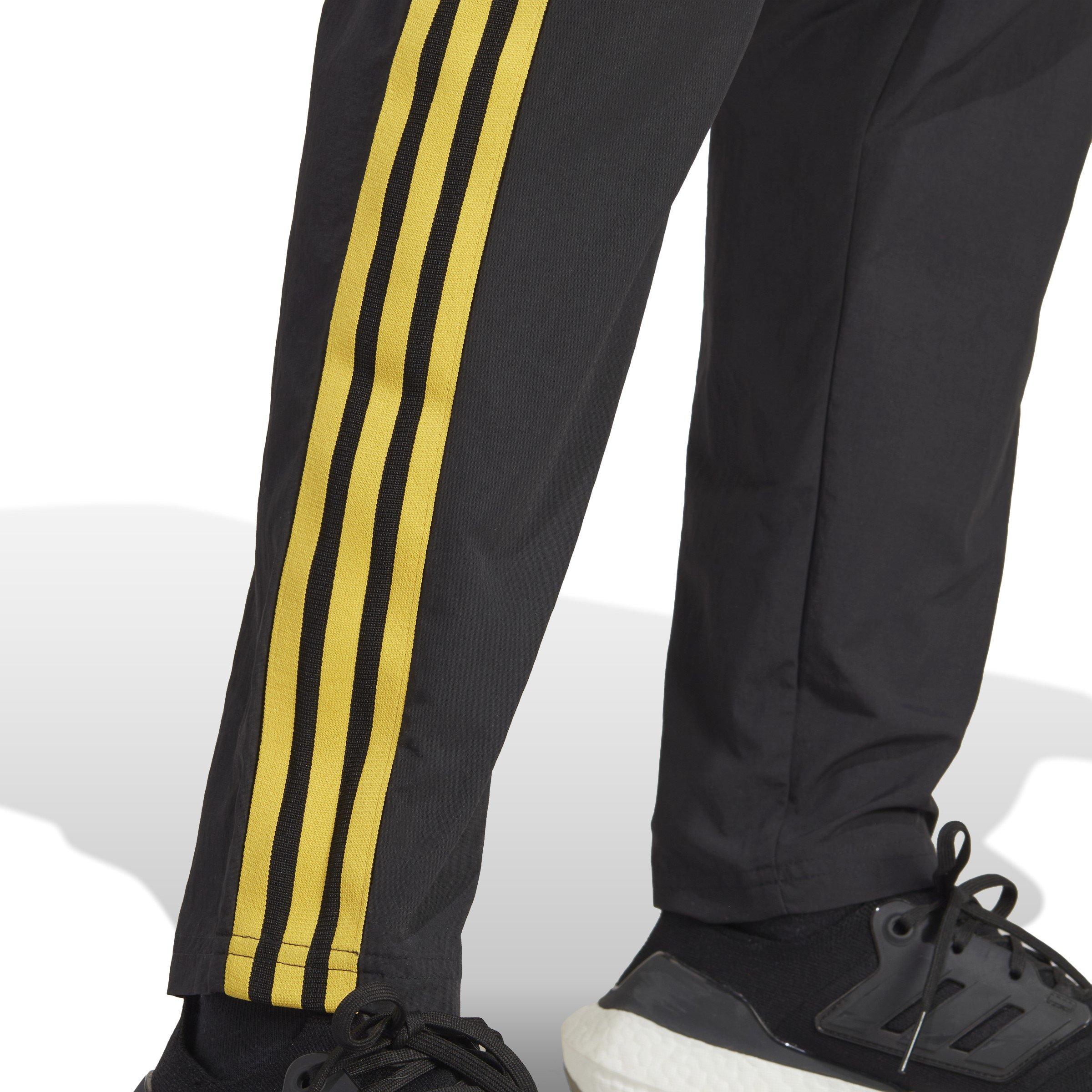 Black and yellow adidas track pants on sale