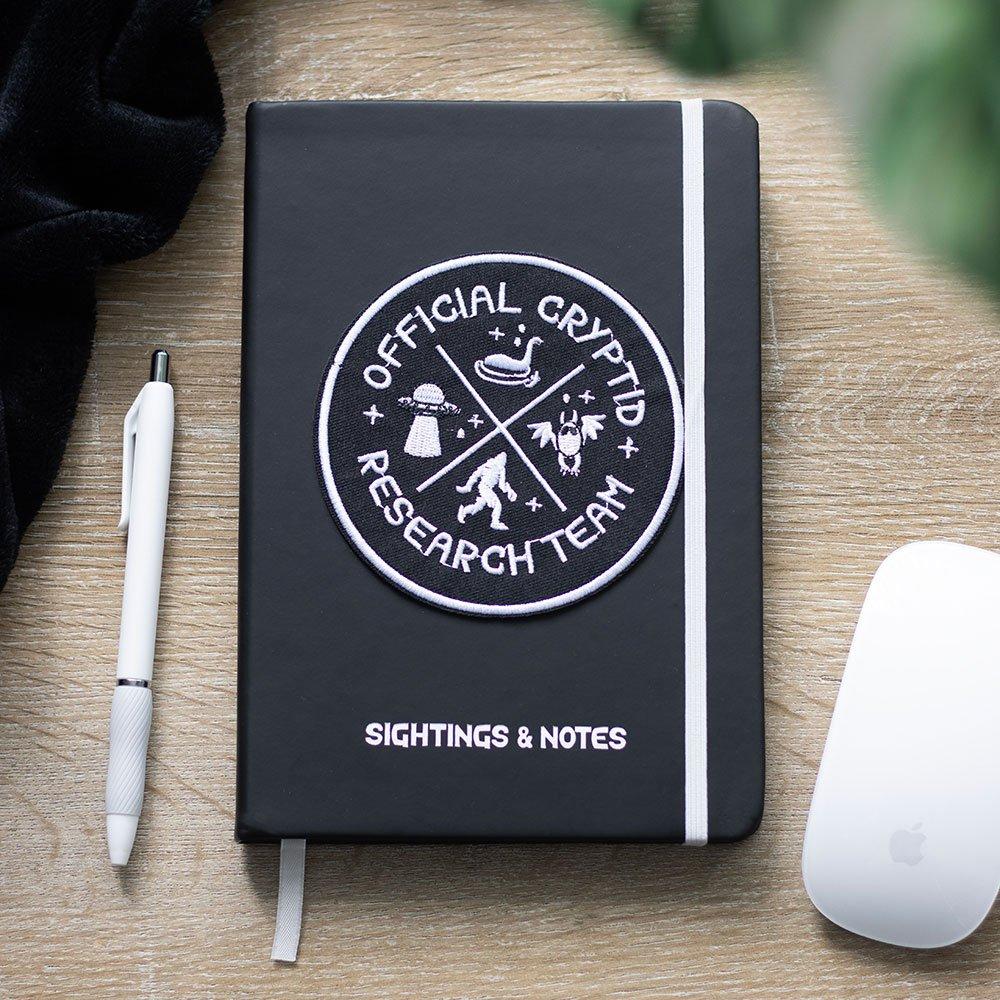 Something Different Cryptid Research Team A5 Notebook