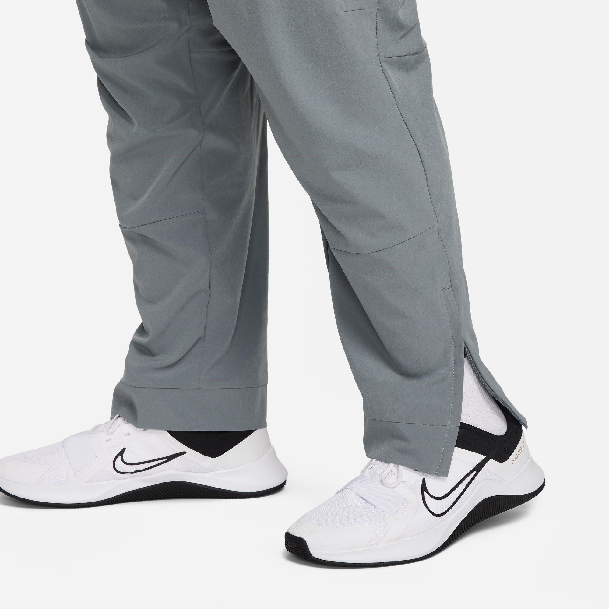 Grau/Schwarz - Nike - Unlimited Men's Dri-FIT Zippered Cuff Versatile Pants - 10