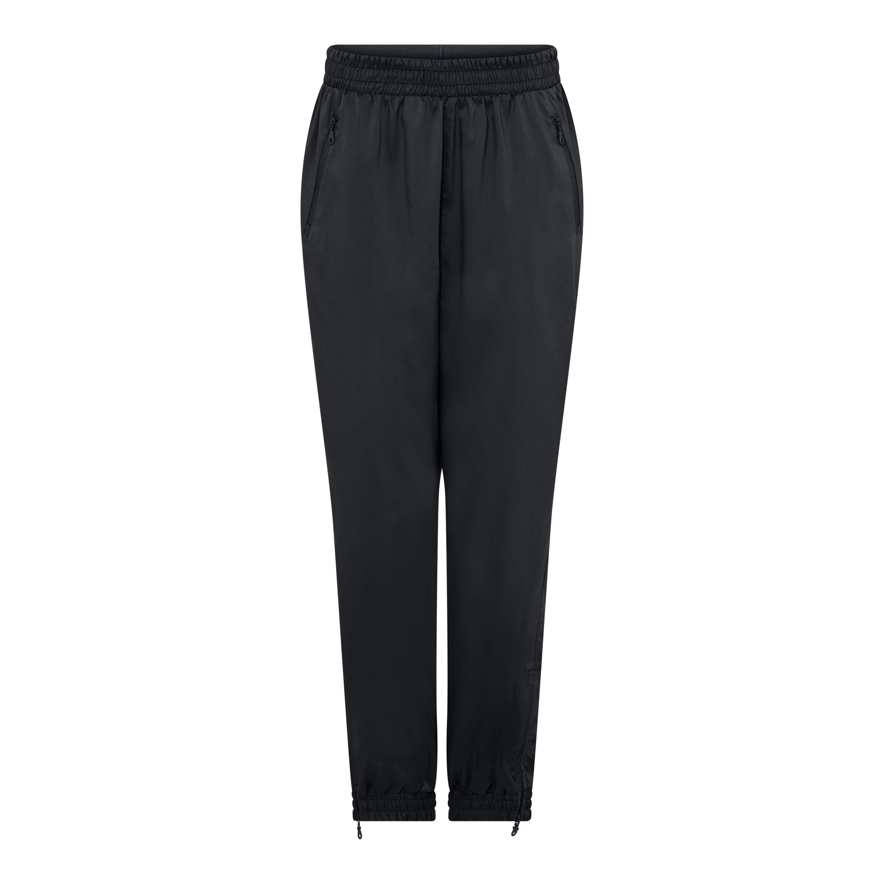 Black - Girlfriend Collective - Women's Summit Closed Hem Woven Tracksuit Joggers - 1