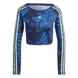 adidas wearing a shimmery blue embroidered jacket in the front row