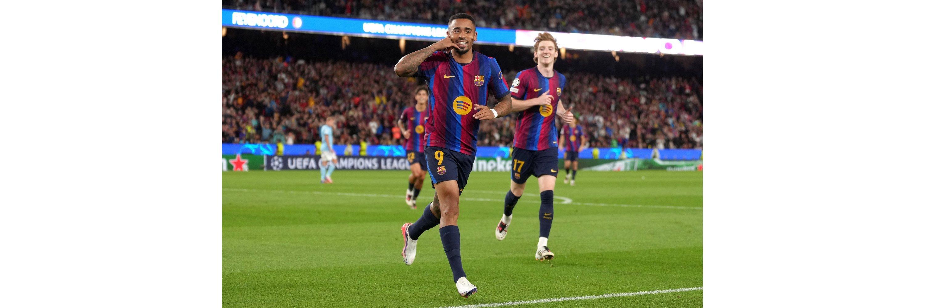 A barcelona football club player celebrating after scoring a goal