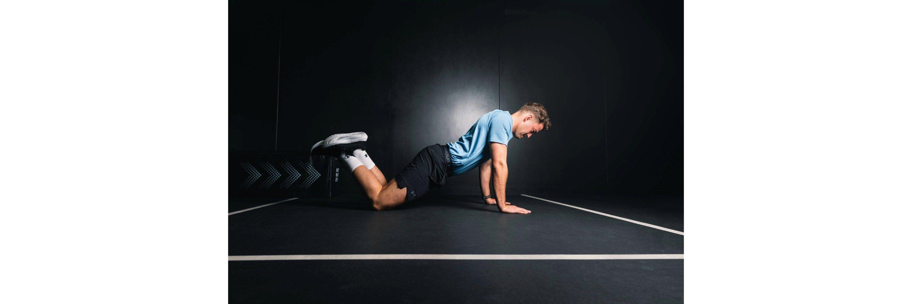 Ethan Allen doing a knee push up