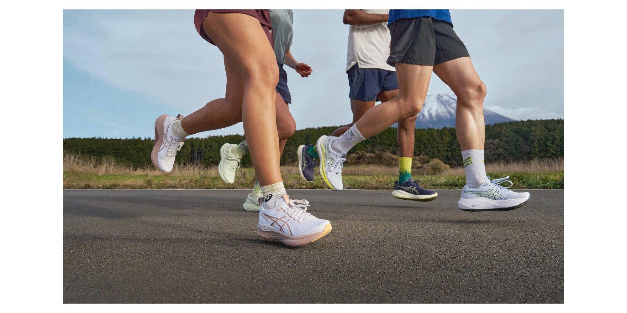 People running in a group, image shows their legs and feet wearing running gear