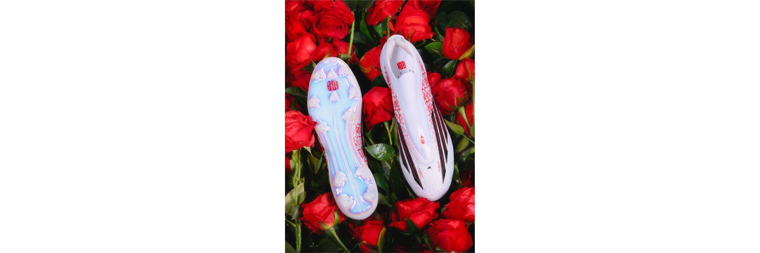 An image of the adidas F50 Lamine Yamal Edition football boots laid on some roses