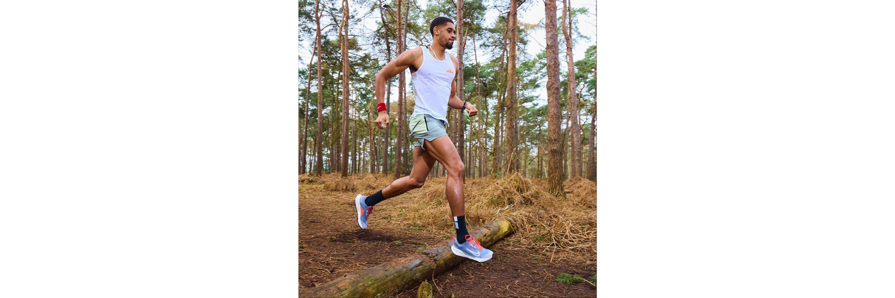 Leon Parkes running through the woods